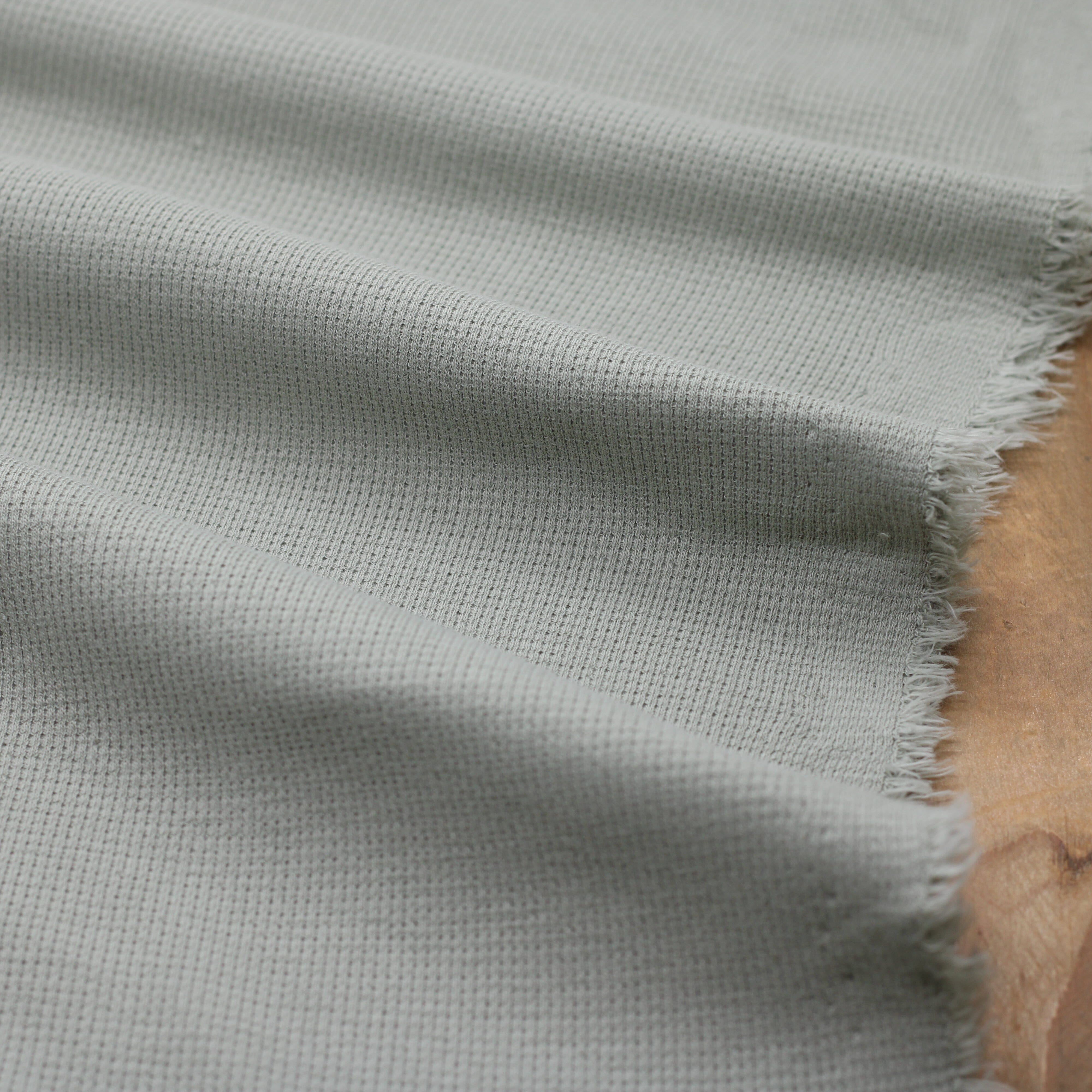 Tissu Jersey de coton gaufré - Vert Amande (Vendu x10cm) Tissus Sélection Gaspard & Léonie | Gaspard et Léonie Tissus en ligne et Mercerie à Toulouse