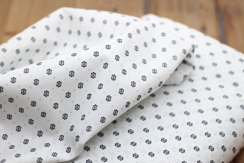 Tissu coton Popeline blanche à Motifs Noirs/Gris (Vendu x10cm) Tissus Sélection Gaspard & Léonie | Gaspard et Léonie Tissus Mercerie Toulouse