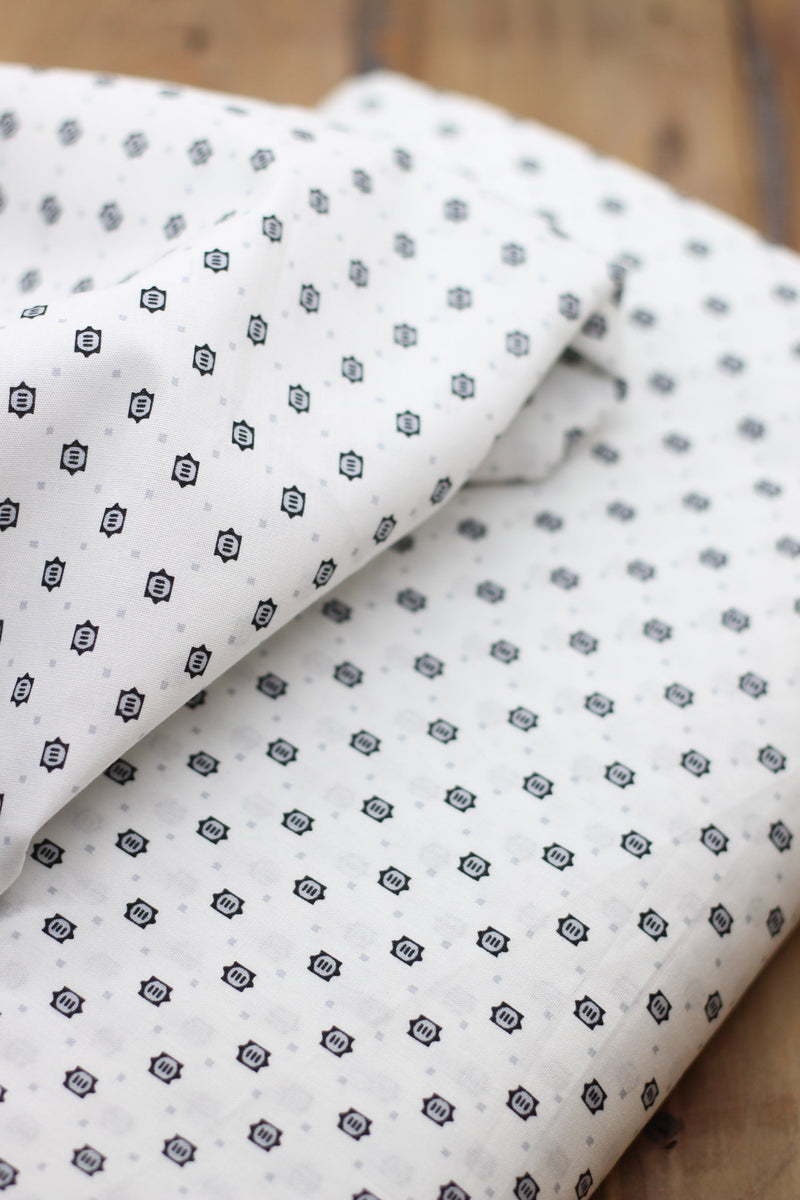 Tissu coton Popeline blanche à Motifs Noirs/Gris (Vendu x10cm) Tissus Sélection Gaspard & Léonie | Gaspard et Léonie Tissus Mercerie Toulouse
