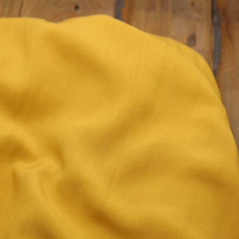 Tissu Viscose Unie - Jaune ocre (Vendu x10cm) Tissus Sélection Gaspard & Léonie | Gaspard et Léonie Tissus en ligne et Mercerie à Toulouse